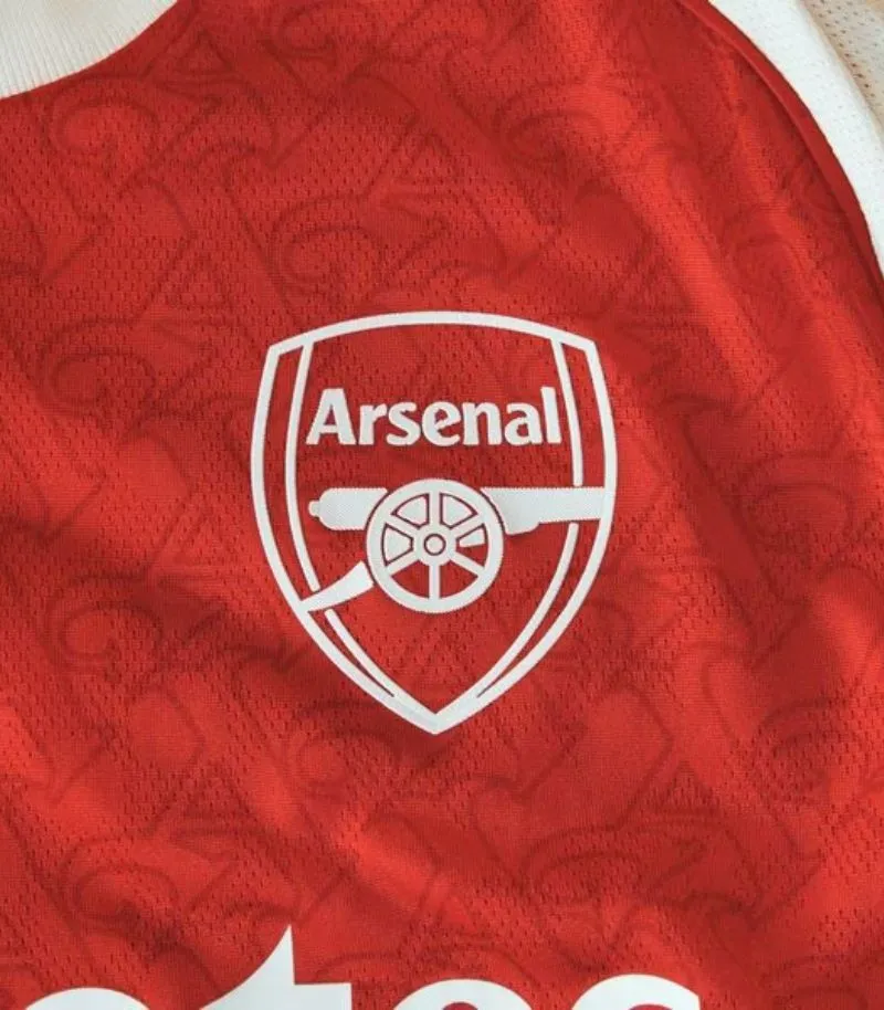 arsenal 2025-26 home kit in red and white with 'A' detailing pattern on the red