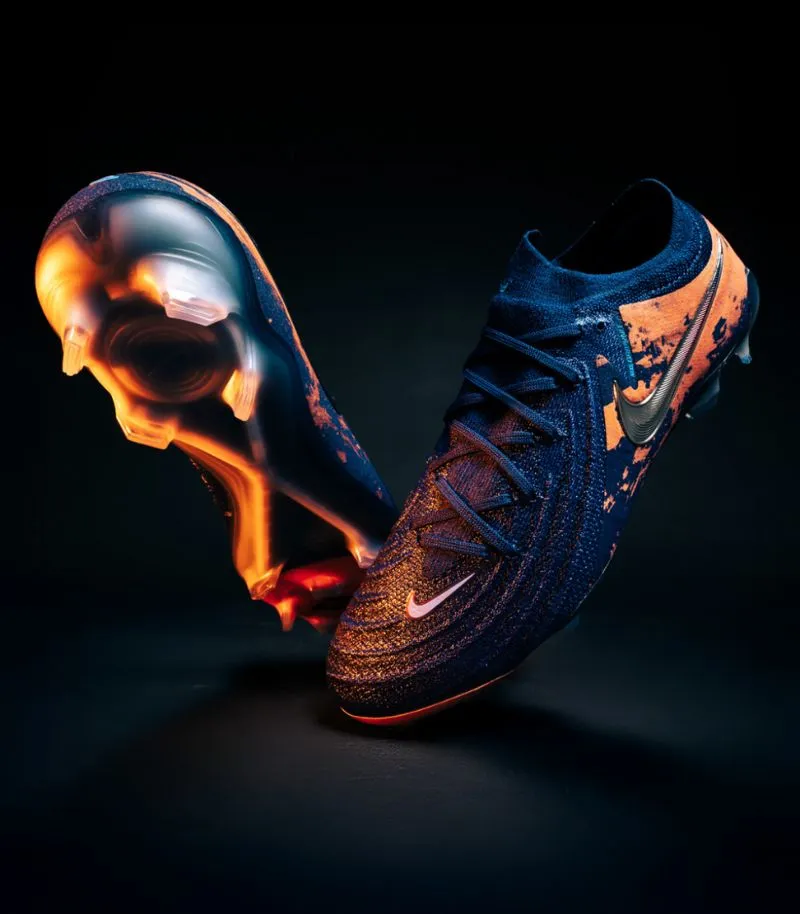 nike phantom gx 2 football boots in Haaland edition, which is navy blue with orange graphics