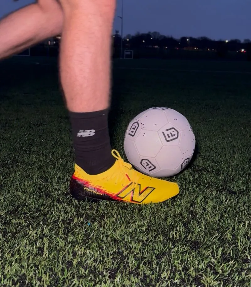 new balance football boots in bright yellow