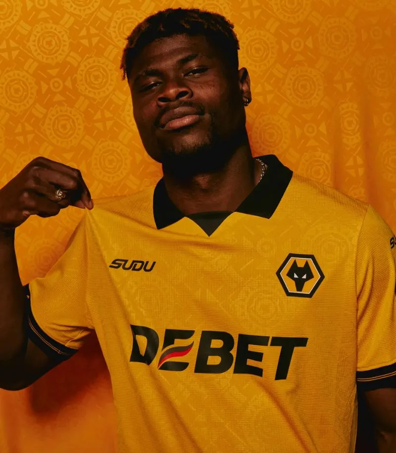 new wolves home kit in yellow with black collar