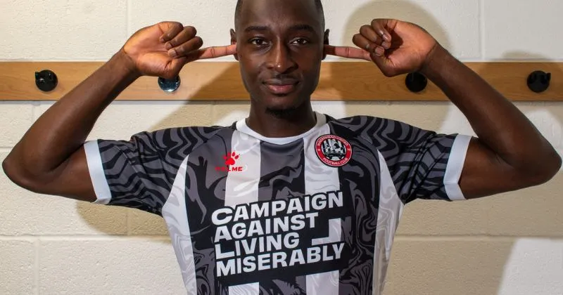 player wearing maidenhead united 2023-24 home shirt in black and white stripes