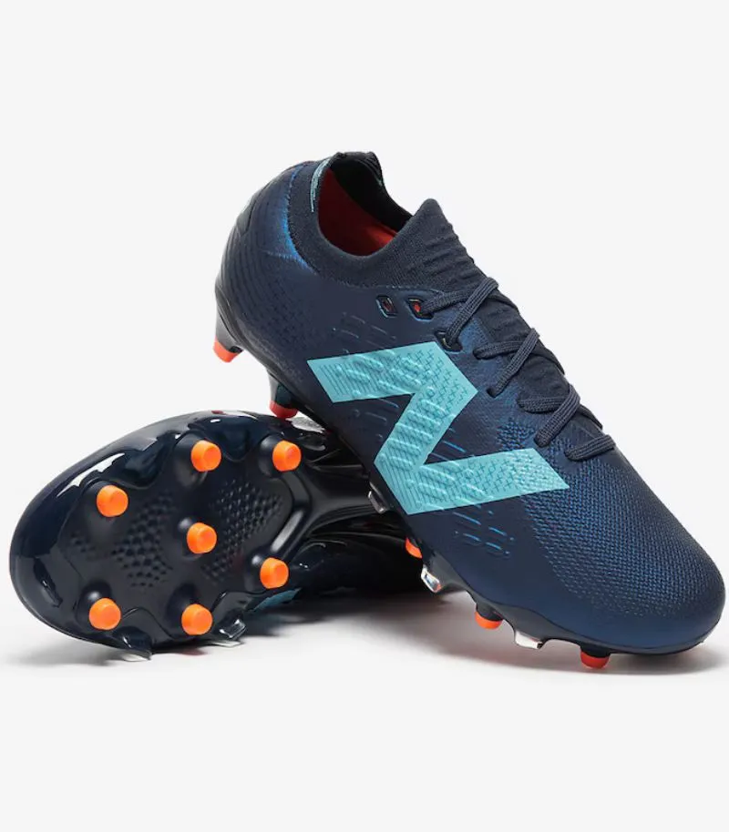 new balance tekela v4+ football boots in navy blue with light blue details