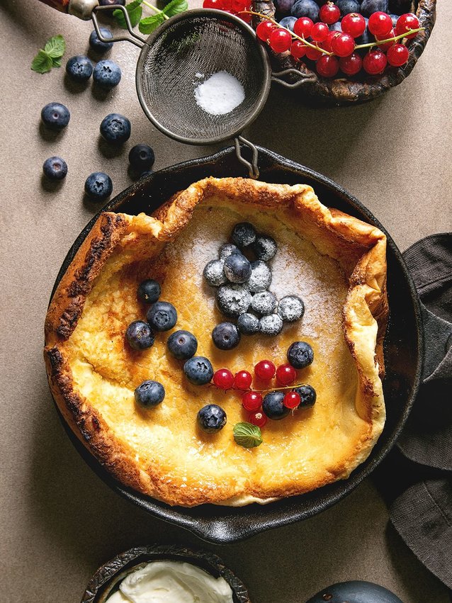 Air Fryer Dutch Baby topped with berries