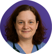 Headshot of Dr. Stephanie Arnold-Galan with shoulder-length curly brown hair, smiling, against a purple circular background.