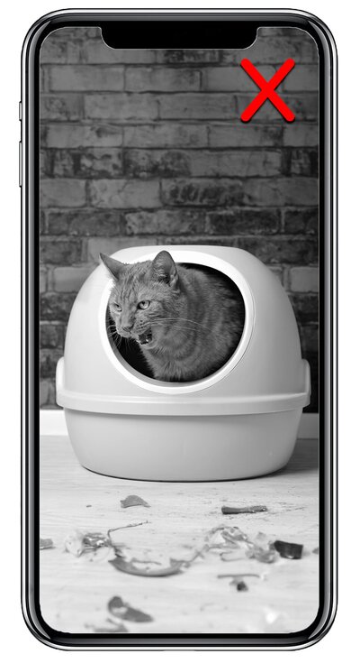 Cat inside a round, enclosed plastic litter box, shown in black and white with a red X in the corner.