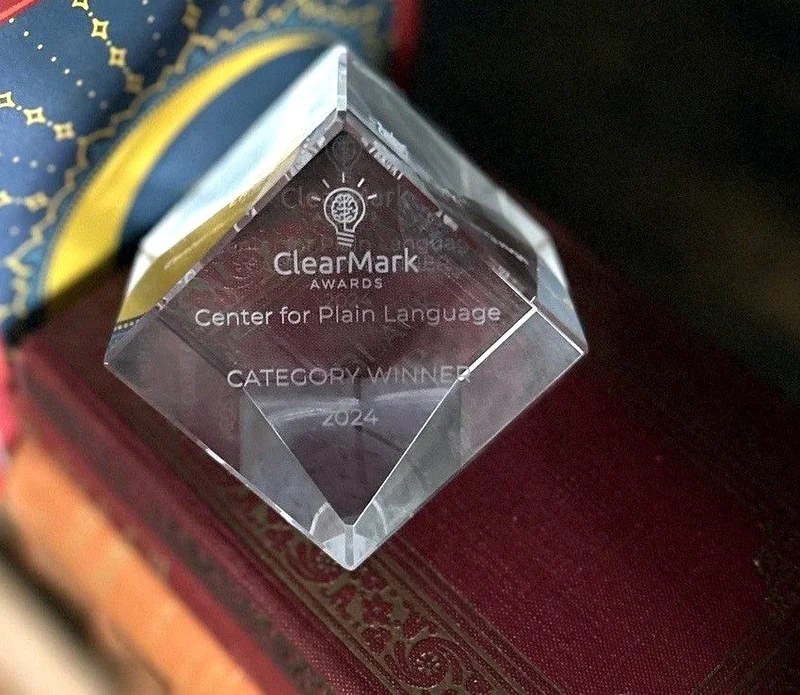 ClearMark Award 2024 category winner trophy photographed on a book