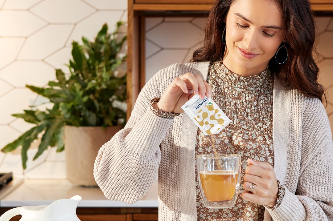 Pouring Unicity's Unimate into cup