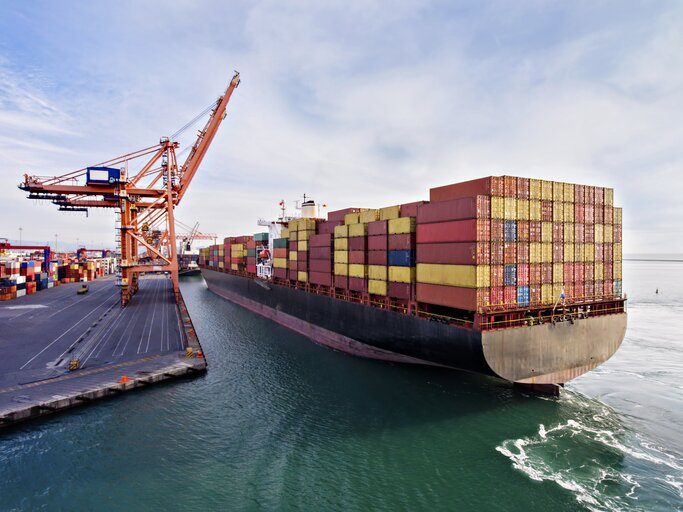 A ship loaded with stacked shipping containers