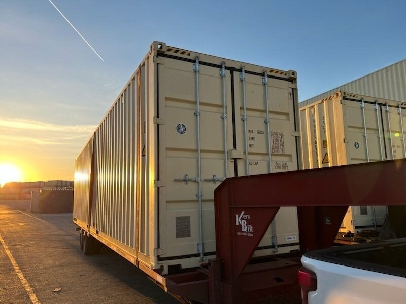 The exterior of a luxury shipping container home.