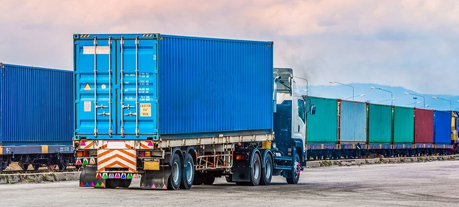 Shipping container loaded onto a truck