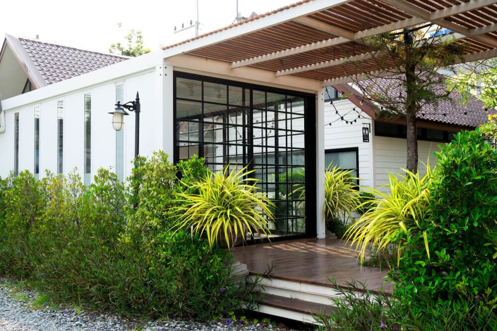 The exterior of a luxury shipping container home.