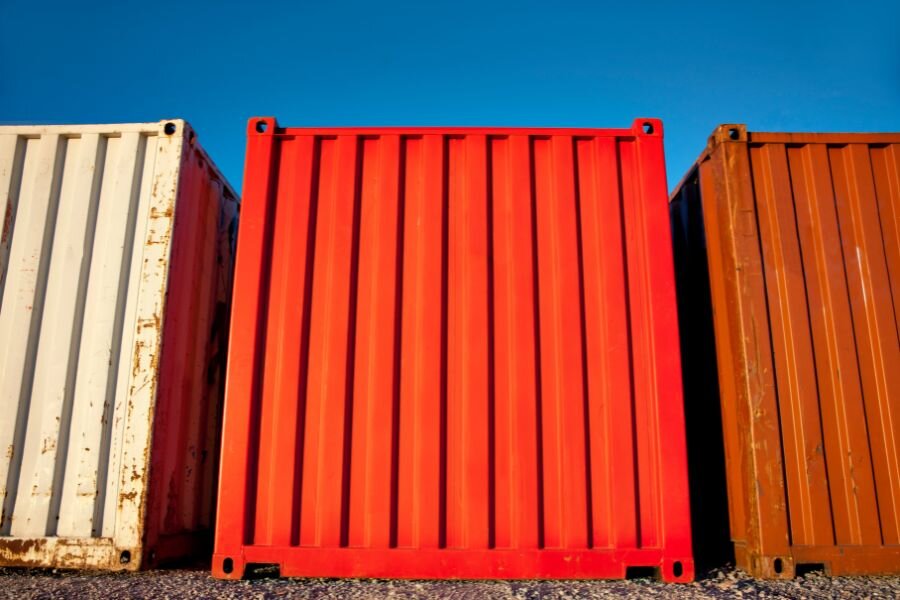 An opening being cut into the roof of a shipping container.