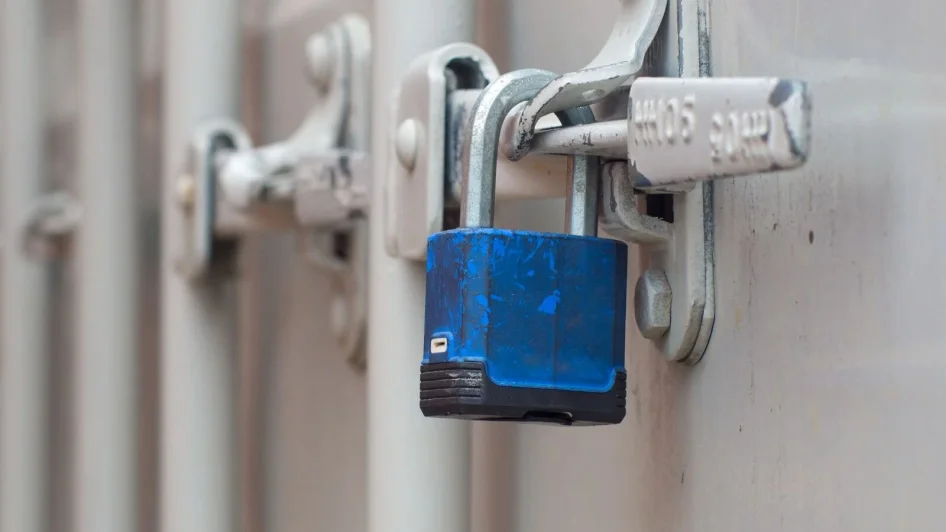 An ISO container door secured with a padlock