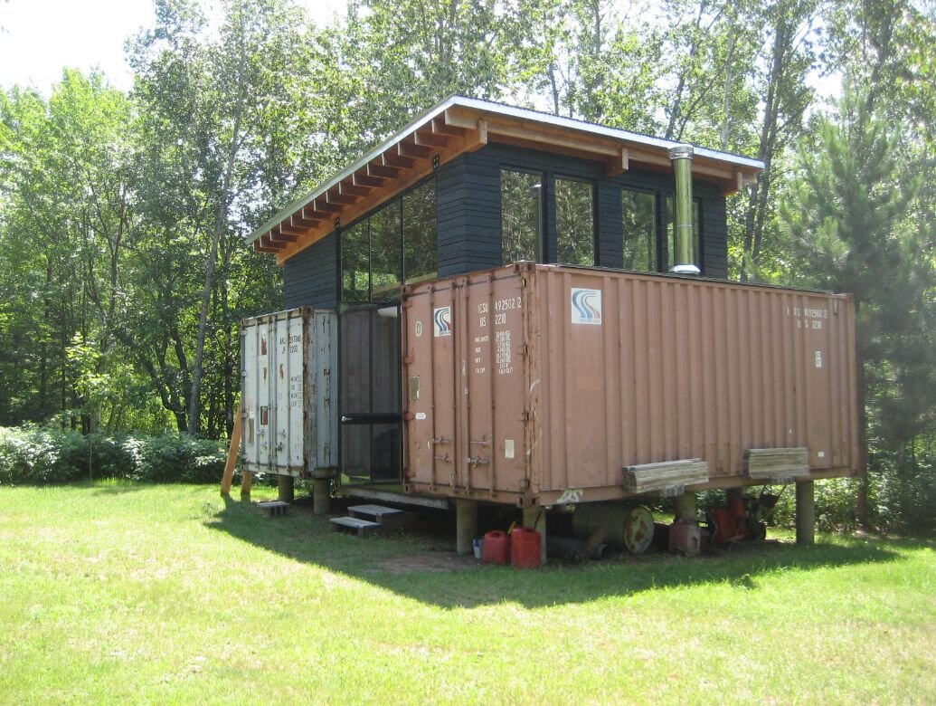 The exterior of a luxury shipping container home.