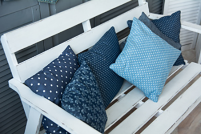 Colorful pillows on porch furniture
