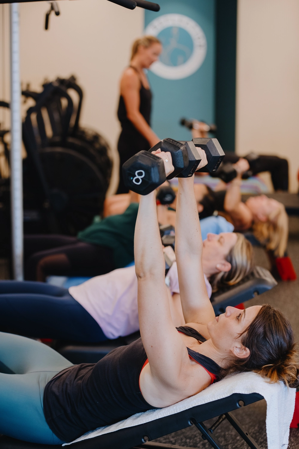 Women doing dumbell chest press