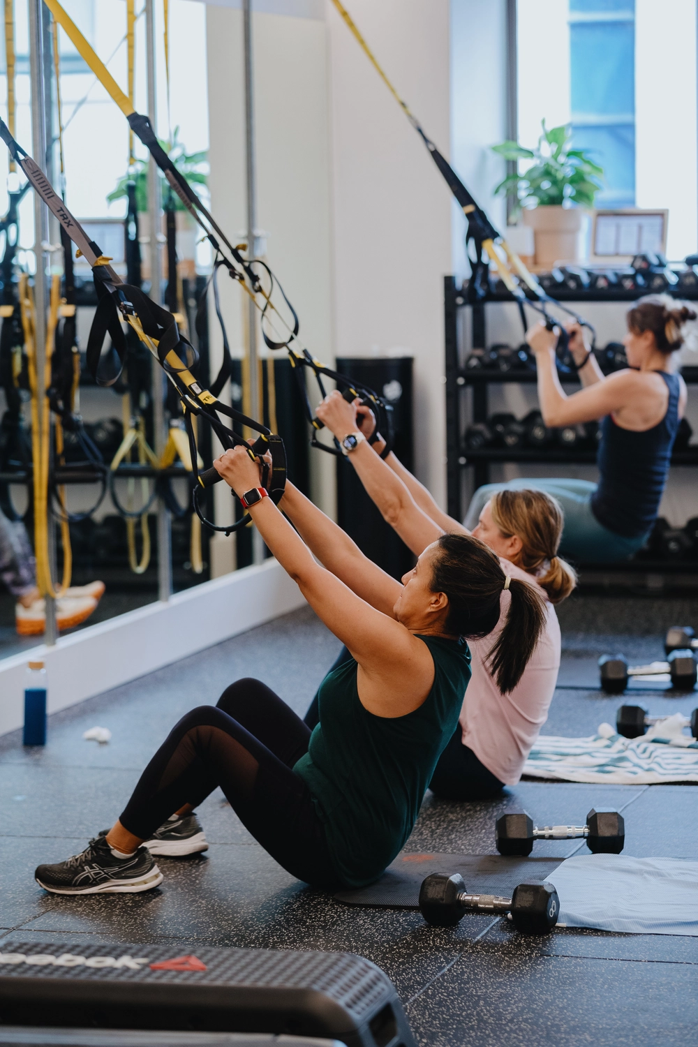 Two women doing a circuit class