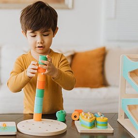 Boy playing with Lovevery toy