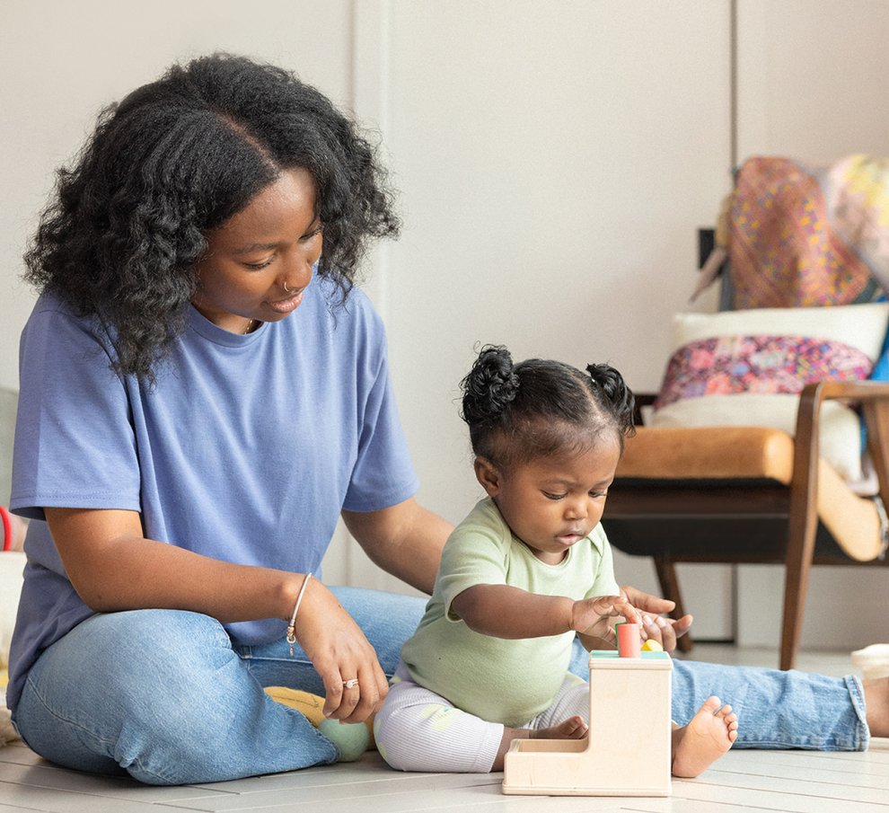 Mother and baby playing with Lovevery toys