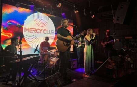 A poster for Mercy Club event