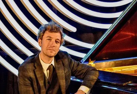 A poster for  Adam Bodine Trio: Covering the Spread event