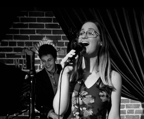 A poster for Ella Fitzgerald birthday celebration with Louisa Amend event