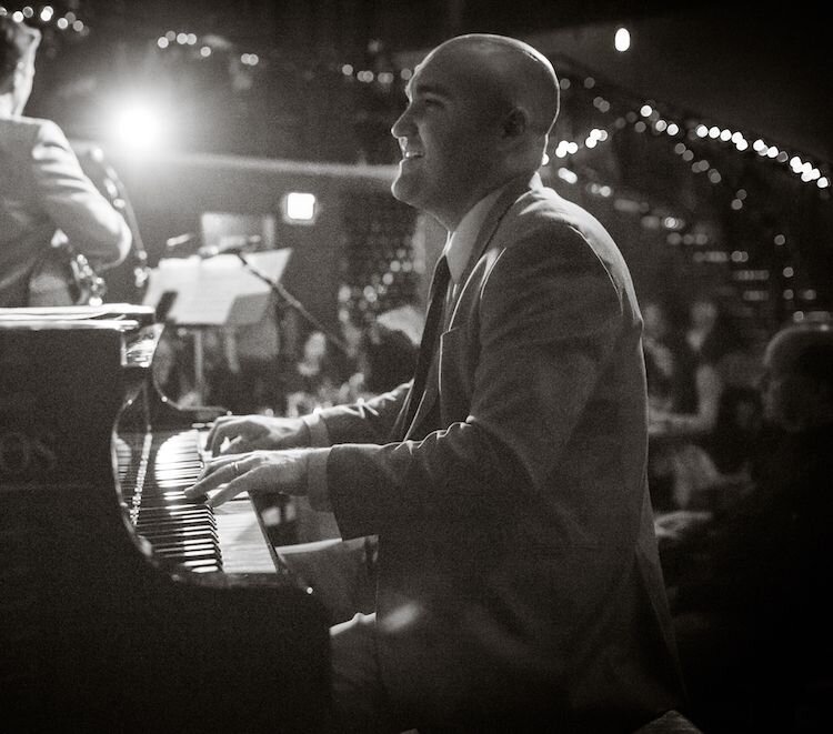 A poster for The Ben Markley Trio event