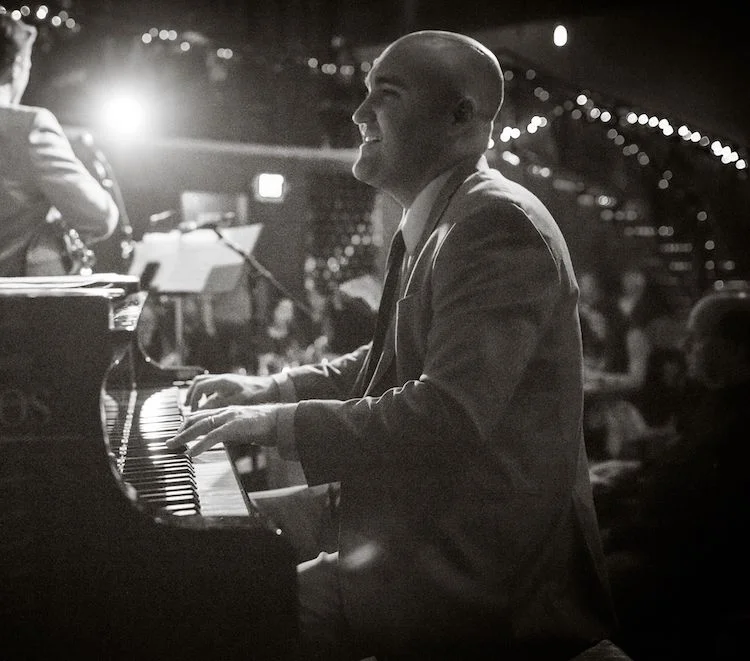 A poster for The Ben Markley Trio event