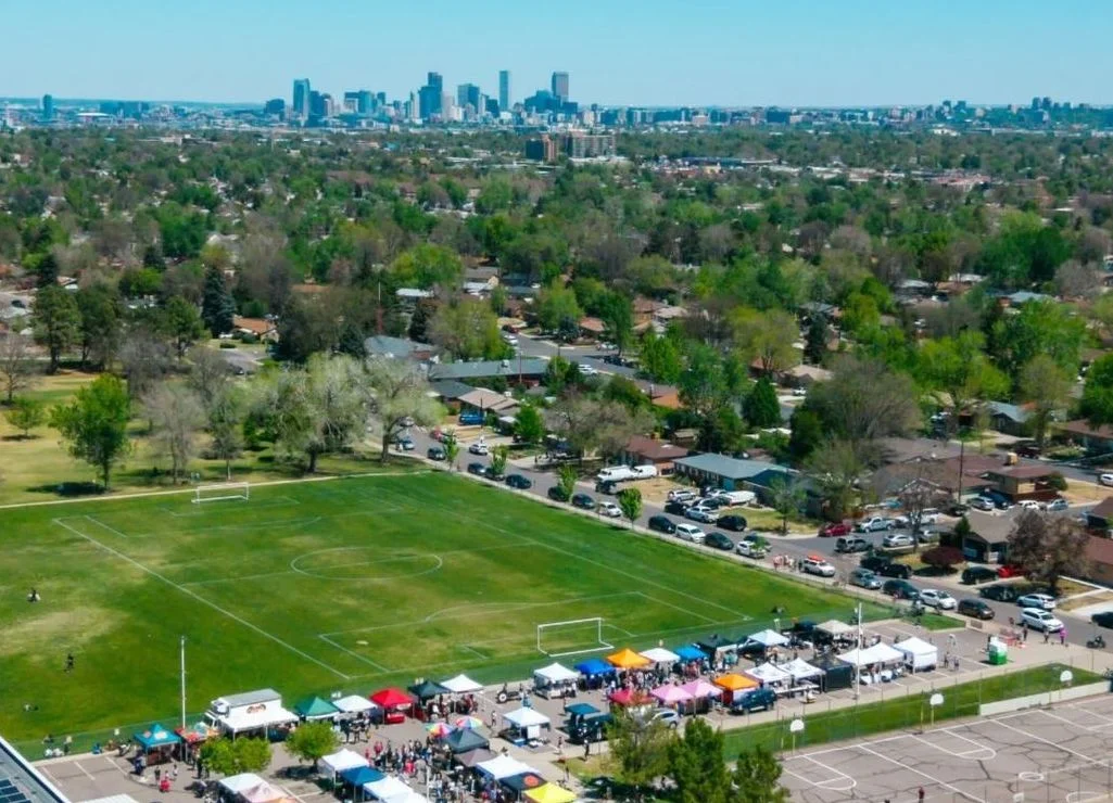 Aerial view of Harvey Park Farmers Market and Denver Skyline