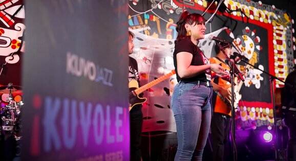 La Molly announcing KUVOLE performance of 2MX2