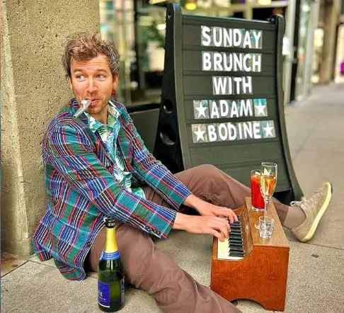 A poster for Dazzle Brunch with Adam Bodine event