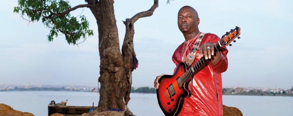 A poster for Vieux Farka Touré event