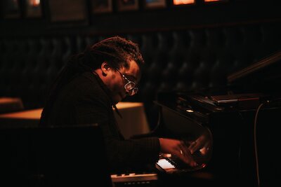 A poster for The Max Moore Quartet Plays McCoy & Mulgrew event