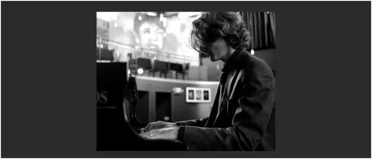 A poster for The Tom Amend Trio event