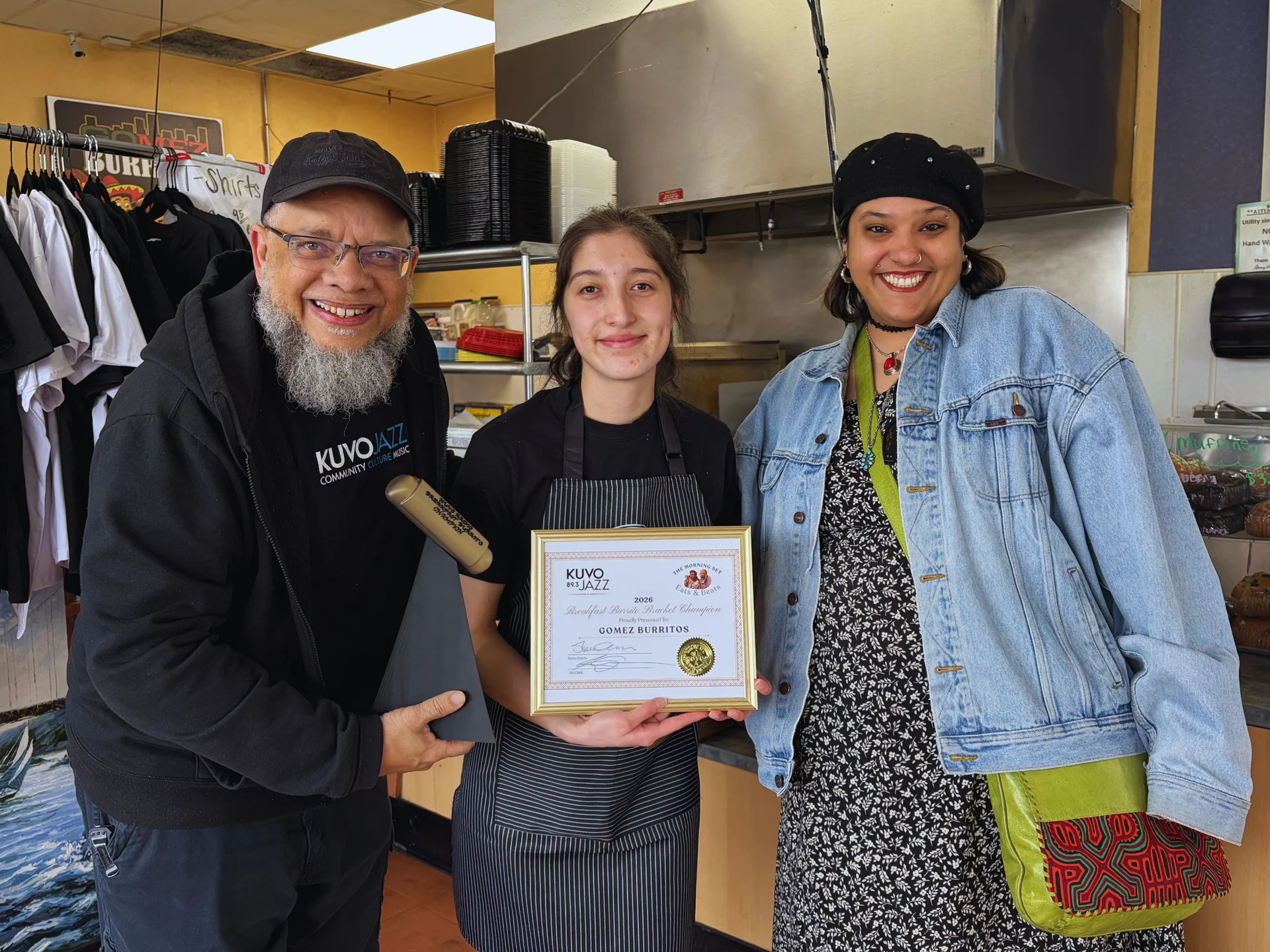 Steve and Abi presenting the winning certificate to manager Brieanna Sanchez of Gomez Burritos