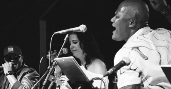 A poster for Latin Dance Party featuring Orquesta La Brava event