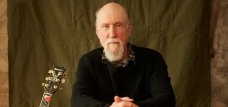 A poster for John Scofield's "Electrospective" featuring Oteil Burbridge, Larry Goldings & Adam Deitch event
