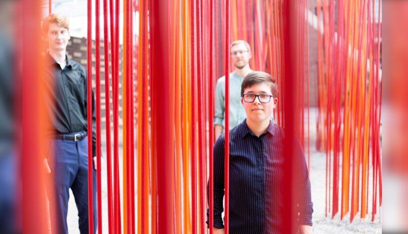 A poster for The Domi Edson Trio event