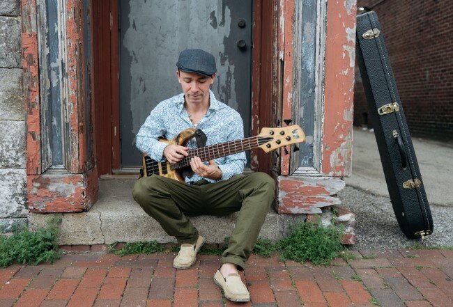 A poster for John Ferrara (of Consider The Source) Solo Bass Performance event