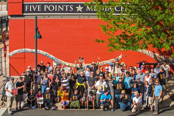 KUVO group in front of Five Points Media Center