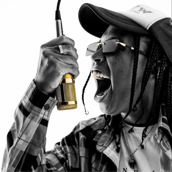 Triiip singing into microphone