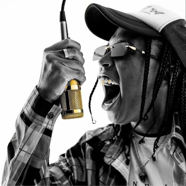 Triiip singing into microphone