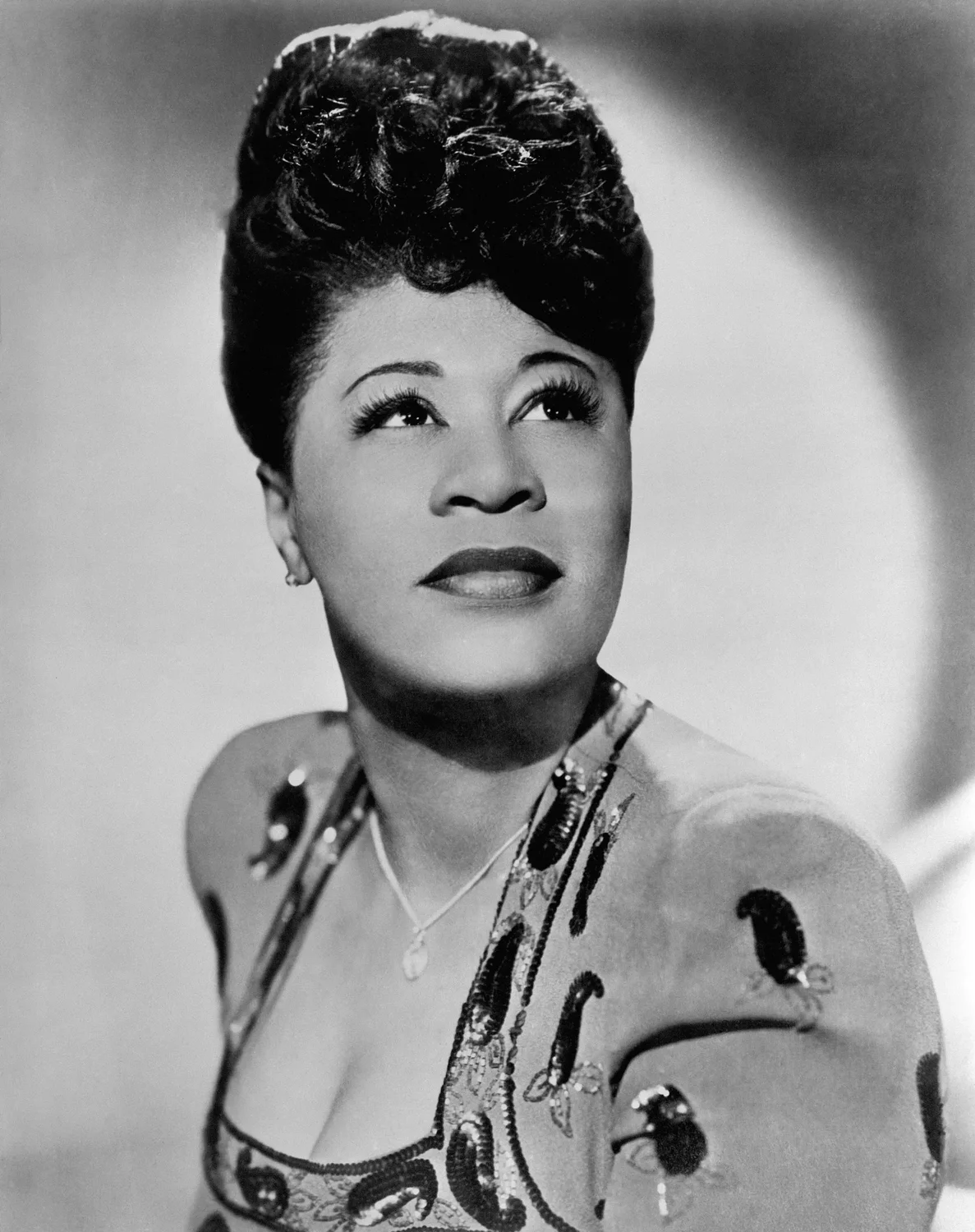 Portrait of American blues singer Ella Fitzgerald. She is shown posing in a studio in a sequined dress. Undated photo circa 1940s. (Bettmann Archive/Getty Images)