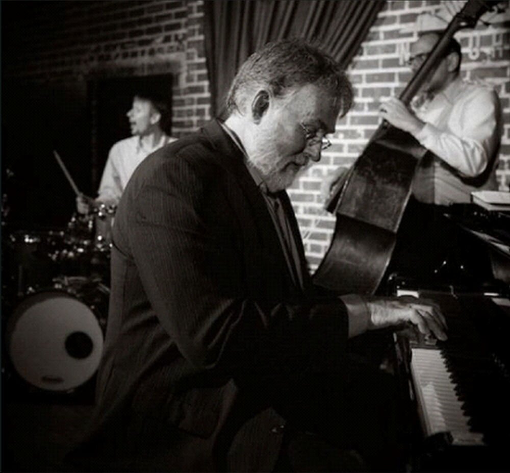 A poster for The Eric Gunnison Trio event