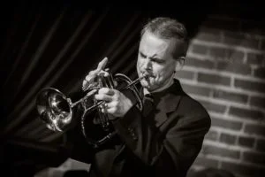 A poster for Derek Banach Quintet: A Modern Groove event