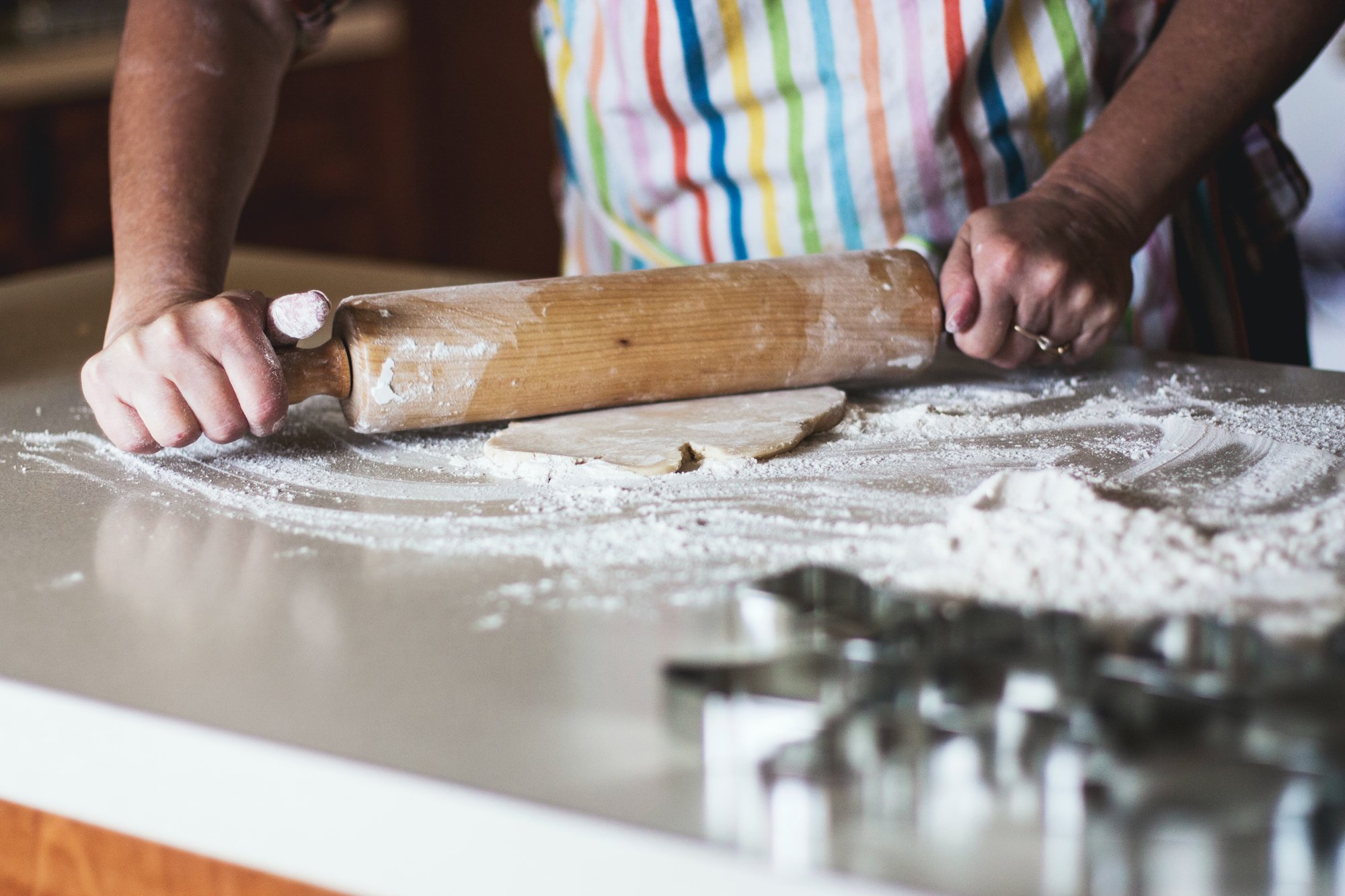 A photo showing someone rolling out dough