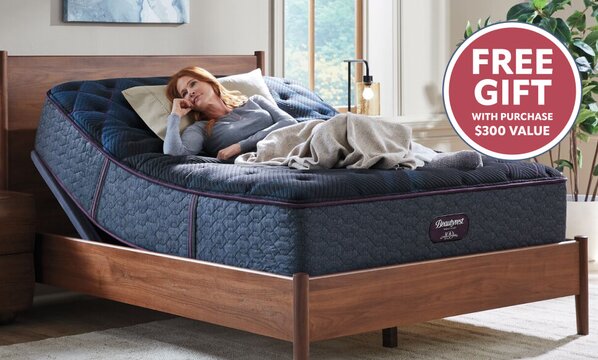 Woman on Beautyrest adjustable bed