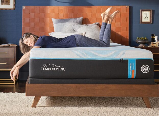 Woman laying on mattress