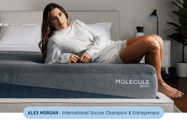 Alex Morgan laying on Molecule mattress