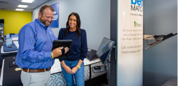 image of store associate showing customer their personalized bed matches
